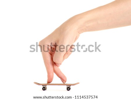Skateboard toy in hand on a white background isolation
