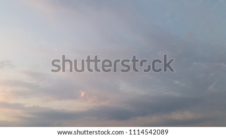 Sunset. Clouds at sunset. Background for postcards. Clouds photo at sunset