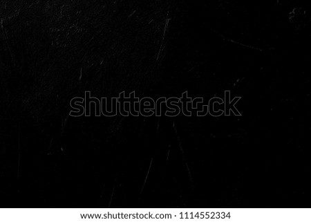 black scratched background. distressed dark stucco plaster texture decor. free space concept