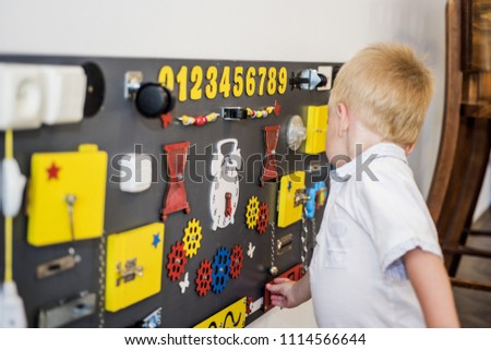Small boy in children's room.  Abstract photo of childhood.