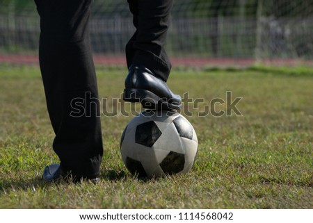 Businessman playing with soccer ball, Asian businessman with football in the stadium foolball, Soccer ball
