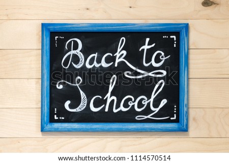 board with chalk, back to school, wooden background