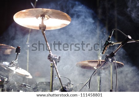 cymbals set in light of searchlights