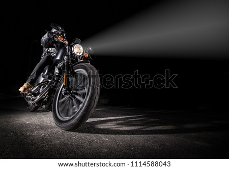 High power motorcycle chopper at night with shinning light. Royalty-Free Stock Photo #1114588043