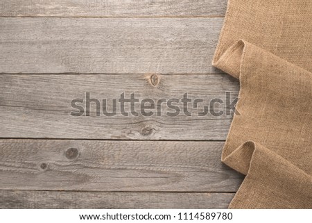 Texture of the old burlap and wood 