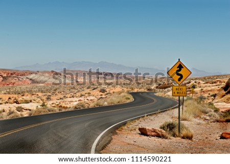 Asphalt Street in Red Rock Canyon with desert scenery