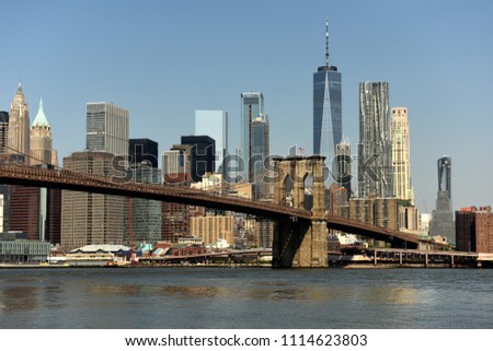 New York cityscape. New York City, financial district in lower Manhattan view from Brooklyn Bridge Park.