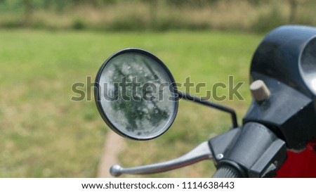 dirty motorcycle mirror
