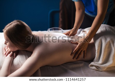 Massage and body care. Spa body massage treatment. Woman having massage in the spa salon . Massage woman hands Royalty-Free Stock Photo #1114641257