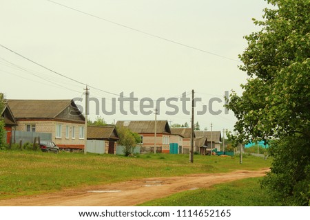 A wide street in the village. Countryside. View. Landscape.