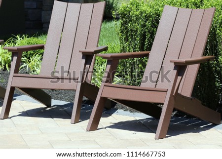2 chairs out in the sun. Royalty-Free Stock Photo #1114667753