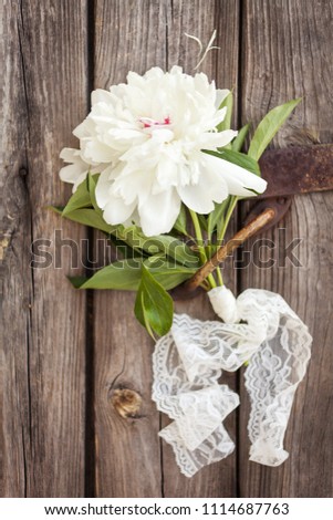 Bunch, bouquet of white  peonies on a wooden background. Frame of flowers. 