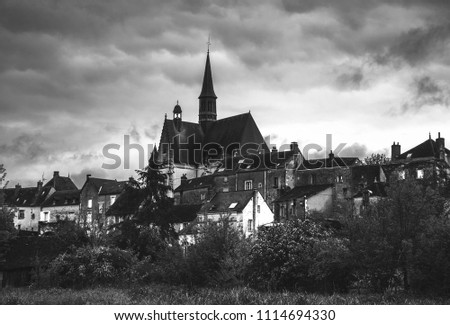 Picturesque view of Montresor village with  church of Saint John the Baptist. Indre-et-Loire, France. Black and white photo.