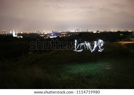 Drawing with light is the inscription love

