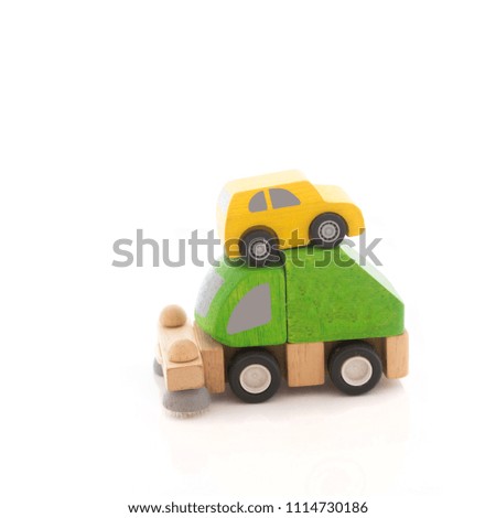 wooden car toy on white background.