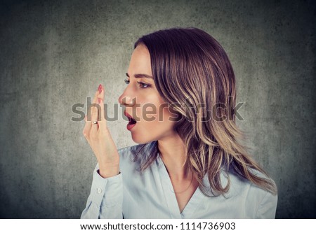 Woman doing a hand breath test. Royalty-Free Stock Photo #1114736903