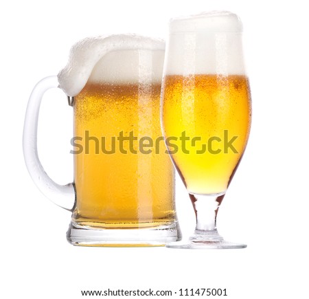Frosty glass of beer with foam isolated on a white background