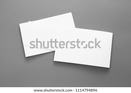 Blank portrait mock-up paper. brochure magazine isolated on gray, changeable background / white flyer paper isolated on gray