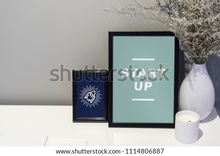 Start up quote and illustration in picture frames