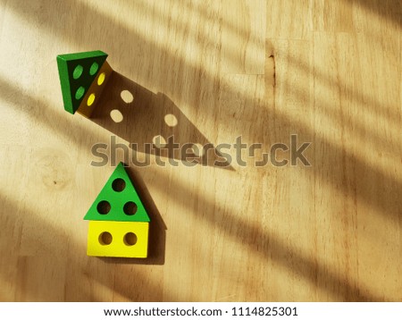 Colourful toy for kid learning on wooden background. Picture of a Classic Toy for Young Child.