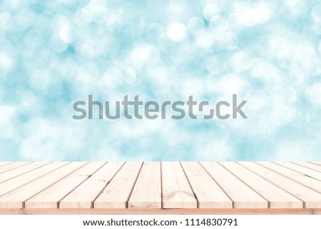 Wood plank with abstract blue blurred bokeh background for product display 
