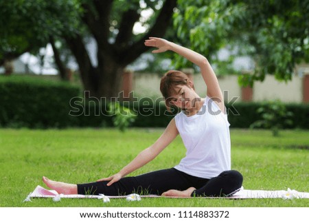 Closeup of beautiful asian women doing yoga in park