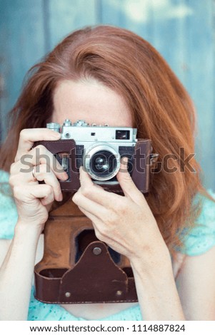 Girl with retro camera. Vintage. 
