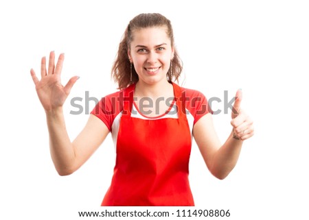 Young woman supermarket employee or storekeeper showing number six with fingers as counting retail worker concept isolated on white background