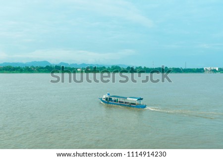 A boat crossing the river from Nakhon Phanom. Thailand to Laos