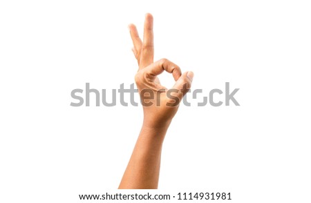 The hand of a black woman doing okay hands on a white background.