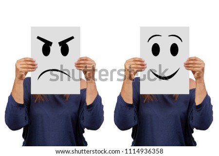 Woman holding cardboard with angry and smile face isolated on white        