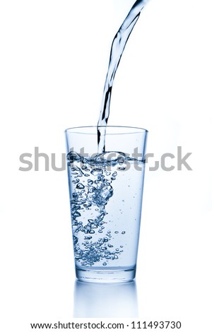 water splashing from glass isolated on white background Royalty-Free Stock Photo #111493730