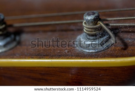 Old acoustic guitar close up. Abstract picture with acoustic guitar in close up.