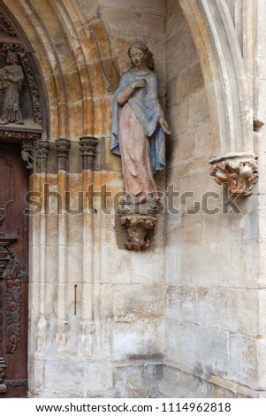 madonna figure on ancient church wall in south german historical city