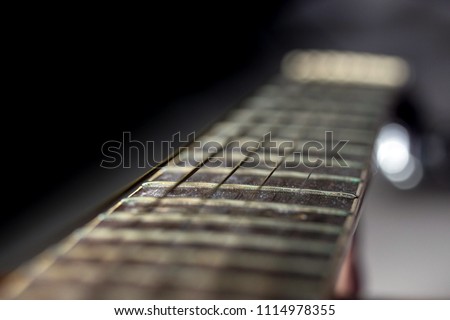 Old acoustic guitar close up. Abstract picture with acoustic guitar in close up.