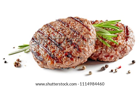 freshly grilled burger meat with spices isolated on white background