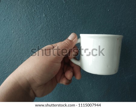 coffee cup  in the hand 