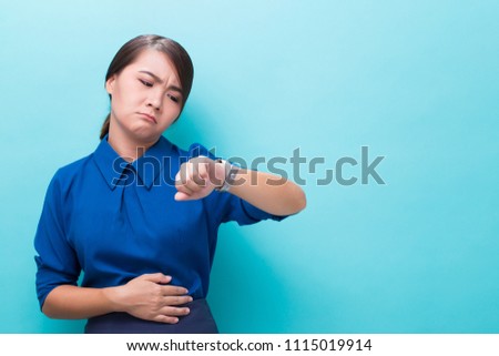 Hungry woman on isolated background Royalty-Free Stock Photo #1115019914