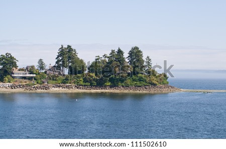 Secluded residences on picturesque Bainbridge Island, WA. Royalty-Free Stock Photo #111502610
