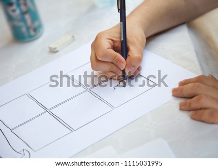 Male hand with pen and white sheet of paper