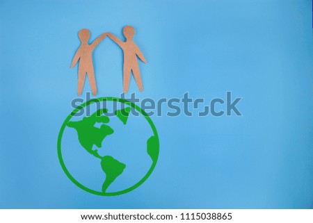 Save world save life concept. people holding the earth