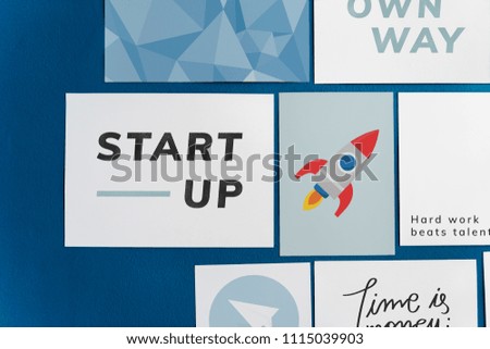 Startup postcard set on a blue wall