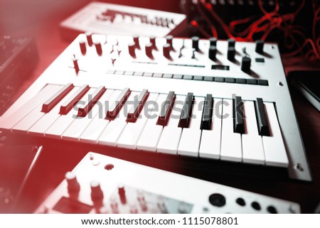 Synthesizer keyboard in music store. Modern midi synth key board for electronic music production. Professional audio equipment for producer. Electronic musical instruments for composer