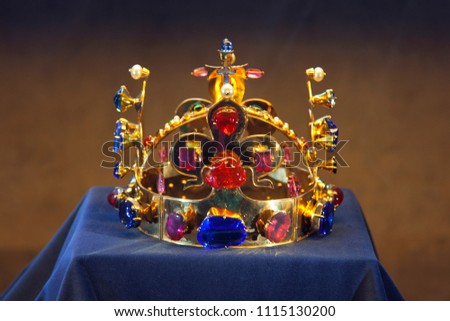 Royal crown with precious stones. A symbol of authority. Gold royal stuff. Precious stones. Unique object of kings.