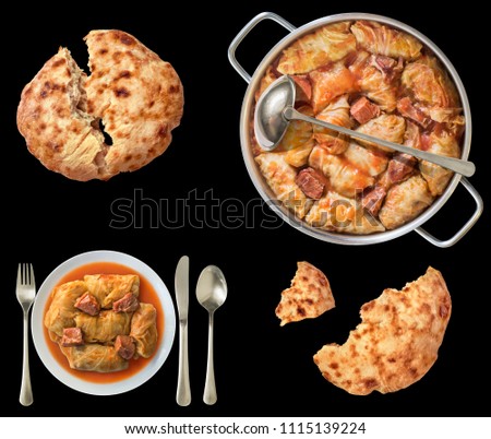 Traditional domestic Stuffed Pickled Cabbage Rolls with leavened Flatbread loaves isolated on black background