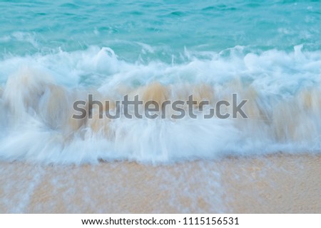 Soft Blue Ocean beach wave of the sea on the sand