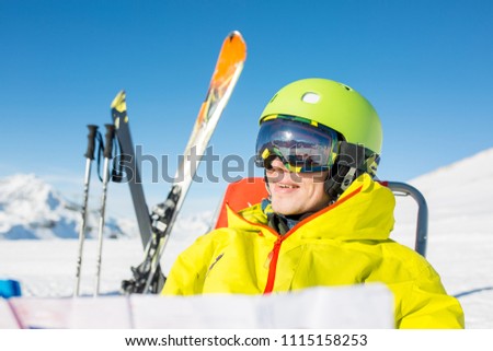 Photo of sporty man in helmet sitting at chair