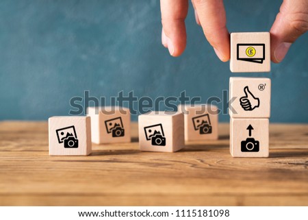Cubes with icons symbolizing how to make money with photos