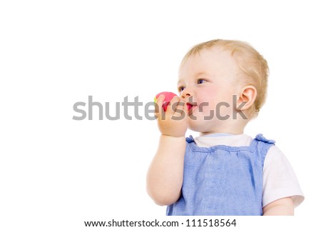 baby takes in mouth toy isolated on white background