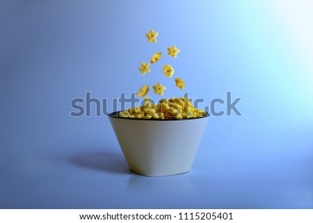 Dry breakfast in a plate on a blue background. Healthy food. Dietary products.